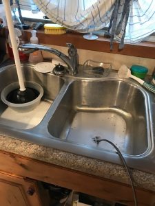 to fix a clogged up kitchen sink