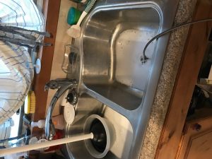 to fix a clogged up kitchen sink
