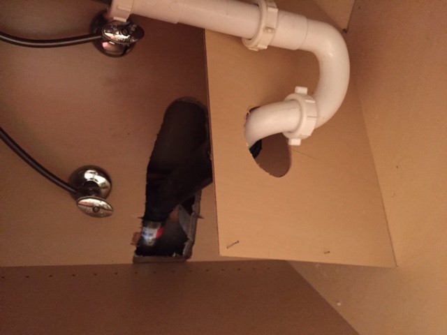 access to the leaky pipe under our bathroom sink