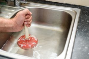 how to unclog a sink with a plunger