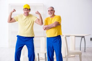 Two repairmen happy after using home hacks